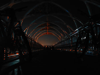 Illuminated footbridge at night