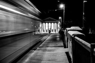 Empty railroad station platform at night