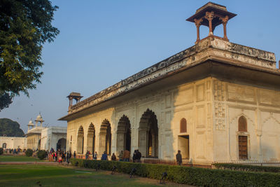 Group of people in front of historical building