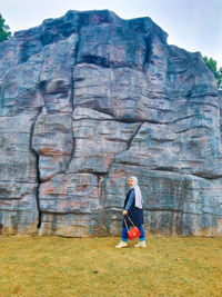 Side view of man on rock