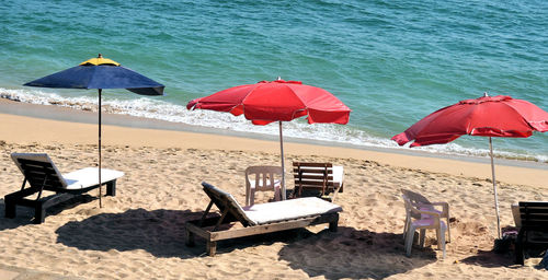 Lounge chairs and parasols on beach