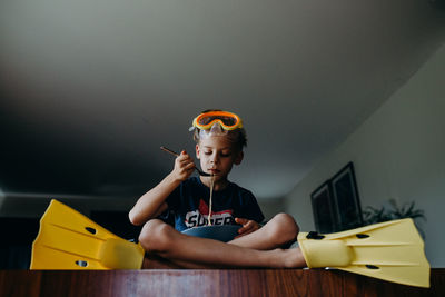 Boy eating food at home