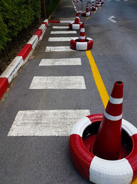 Traffic cones and tires on road