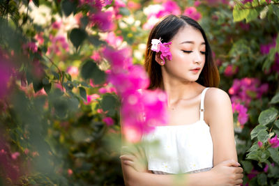 Beautiful woman with pink flower