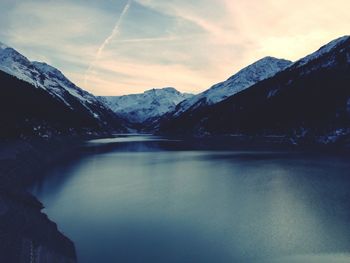 Scenic view of lake against cloudy sky