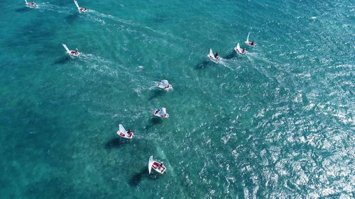 High angle view of people sailing boats on sea