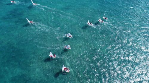 High angle view of people enjoying in sea