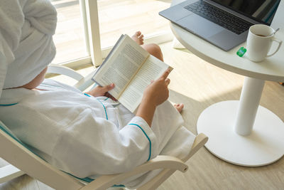 Woman using laptop at home