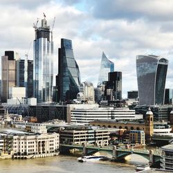 Modern buildings in city against sky