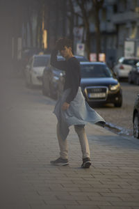 Full length of man walking on street