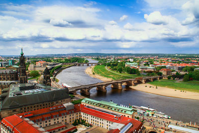 Cityscape against cloudy sky