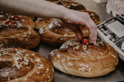 Cropped hand of person holding bread