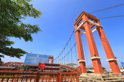 Low angle view of road sign against sky