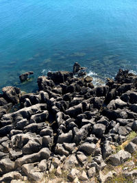 High angle view of pebbles on beach