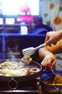 Close-up of person preparing food