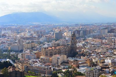 High angle view of buildings in city against sky