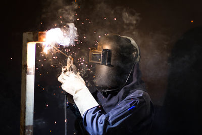 Man working on metal in workshop