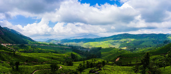 Panoramic view of agricultural landscape against sky