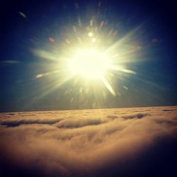 Sun shining through clouds