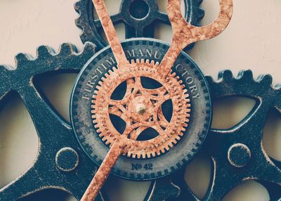 Close-up of vintage clock hanging on wall