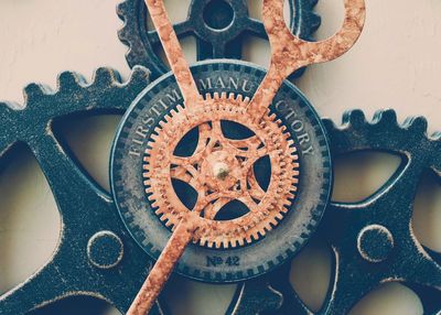 Close-up of vintage clock hanging on wall