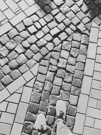 High angle view of people standing on footpath