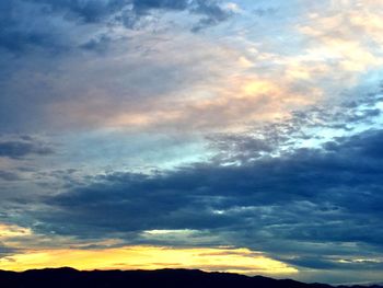 Low angle view of dramatic sky during sunset