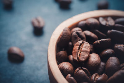 Close-up of roasted coffee beans on table