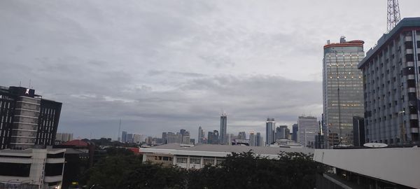 Buildings in city against sky