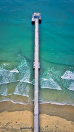 High angle view of deck chairs on beach