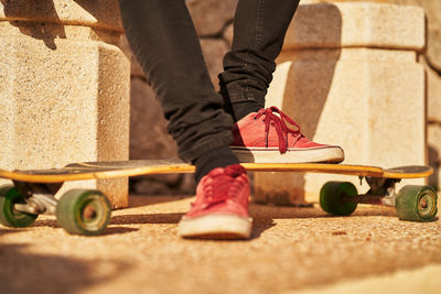 Low section of man wearing shoes