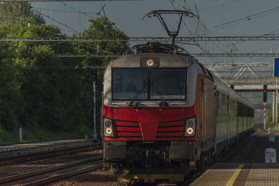 Train at railroad station against sky