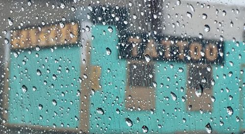 Raindrops on glass window during rainy season