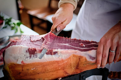 Close-up of man preparing food