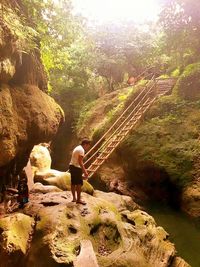 Woman standing on rock formation