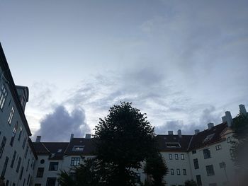 Houses in city against sky