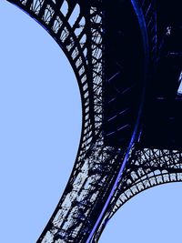 Low angle view of arch bridge against blue sky