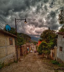 Street amidst buildings against sky