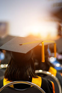 Rear view of woman wearing mortarboard during graduation