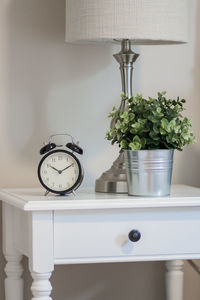 Close-up of flower vase on table at home