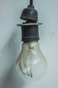 Close-up of glass bottle against white background