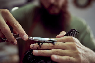 Detailed drawing of a barber cutting hair with scissors