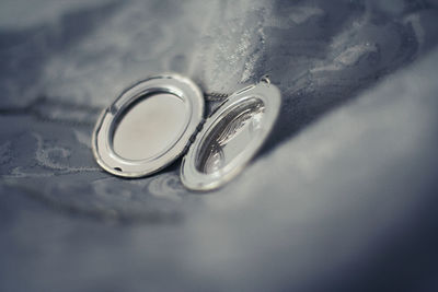 High angle view of wedding rings on table