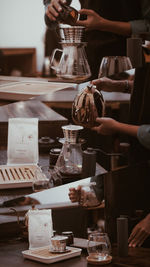 Midsection of person preparing food in kitchen