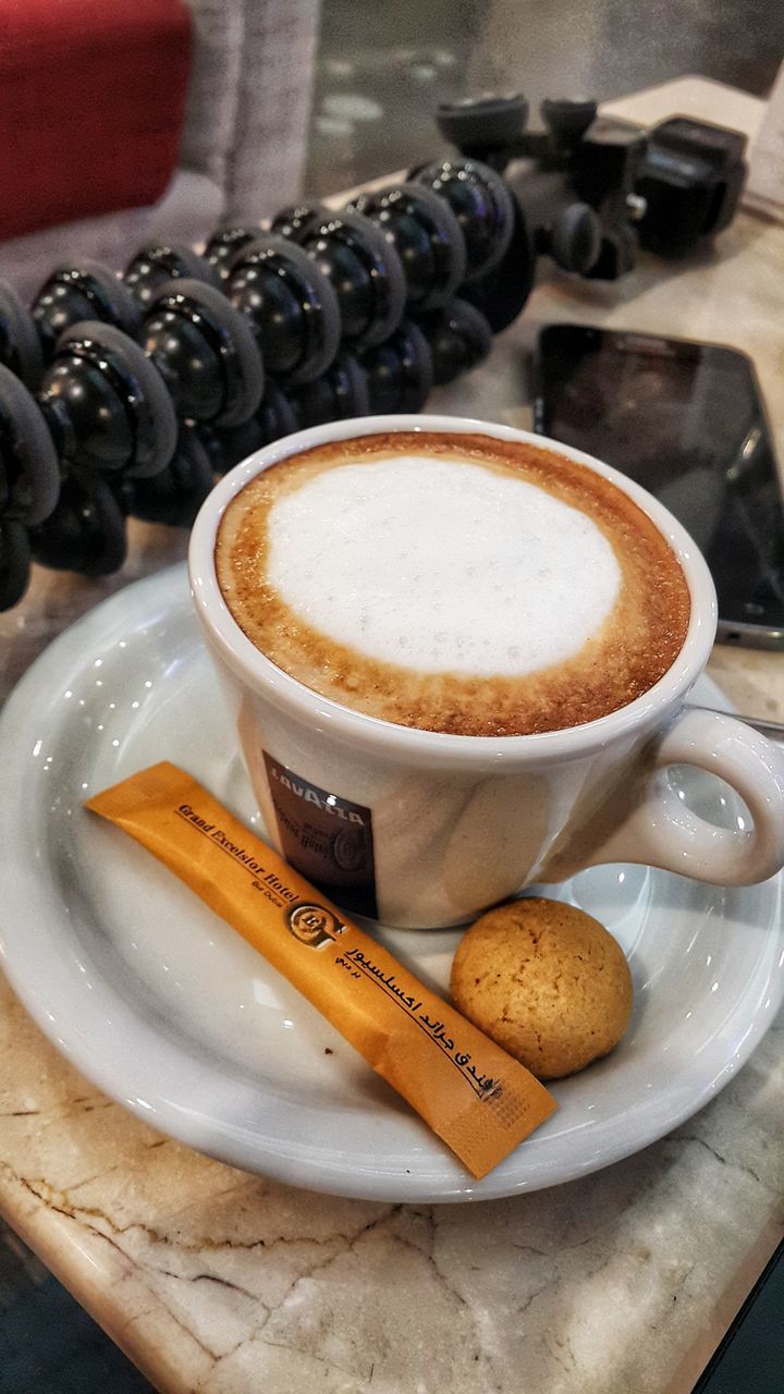 coffee, coffee - drink, food and drink, drink, refreshment, coffee cup, mug, cup, still life, frothy drink, indoors, cappuccino, table, freshness, crockery, close-up, food, saucer, hot drink, focus on foreground, no people, froth, non-alcoholic beverage, latte, temptation