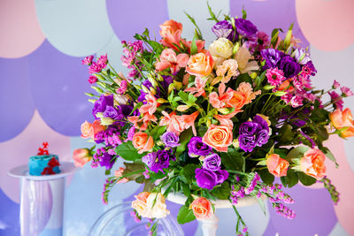 Close-up of multi colored flowers on table