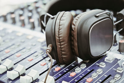 Close-up of headphones on audio equipment