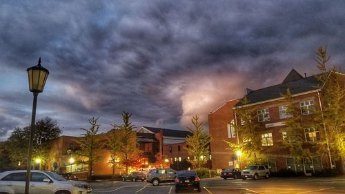 City street and buildings against storm clouds