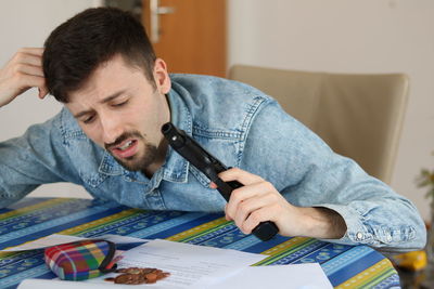 Side view of man working at home