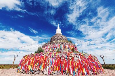 View of temple against cloudy sky